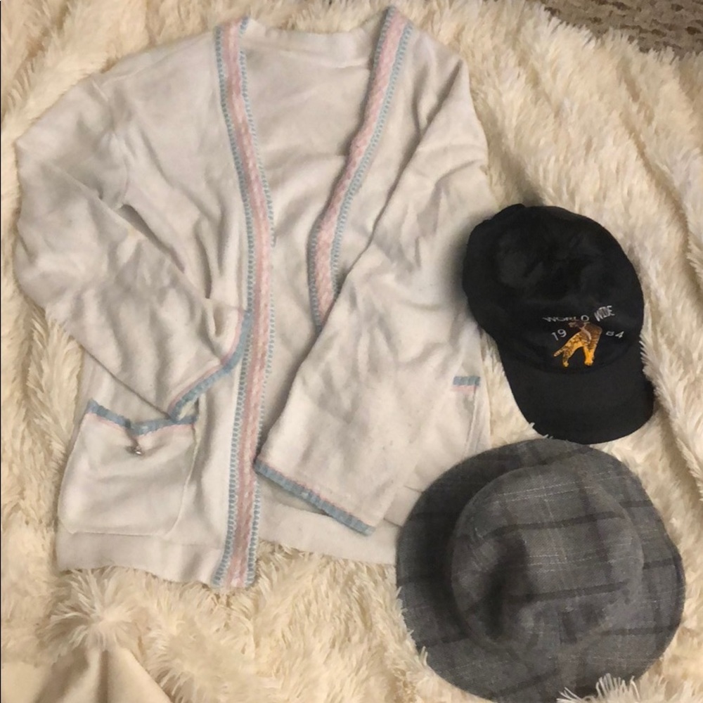 A cardigan and two hats